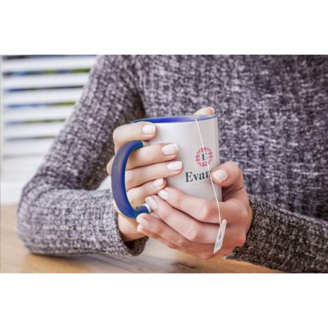 High-quality ceramic mug with coloured interior. The colour of the large handle matches the inside colour, resulting in a playful appearance. The perfect mug for all full colour prints, including photos. Capacity 350 ml.