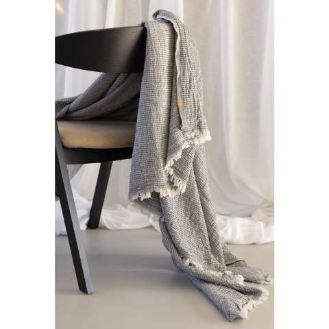 Soft and stylish plaid throw from the Oxious brand. Handmade from recycled textiles in combination with soft, natural cotton: 50% cotton, 42% recycled cotton and 8% RPET. Beautiful as a throw on the sofa, or to use as a blanket or bedspread. This plaid throw symbolizes an elegant lifestyle and is both functional and decorative.  These beautiful, soft cloths are made by local women in a small village in Turkey. They work there in a social context, with room for growth and development. The cloths are handmade with love and care for the environment. Pure enjoyment can begin with a product from the Oxious collection.