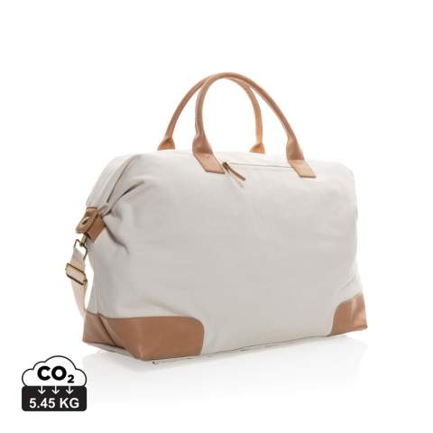 Plan your perfect getaway with this large 16oz. recycled canvas weekend bag. The bag features one big roomy compartment with front pocket and PU handles. The bottom features four brass studs to keep your bag clean when placed on the floor. 2% of proceeds of each Impact product sold will be donated to Water.org. Composition 60% recycled cotton and 40% recycled polyester. Lining in 150D recycled polyester.<br /><br />PVC free: true