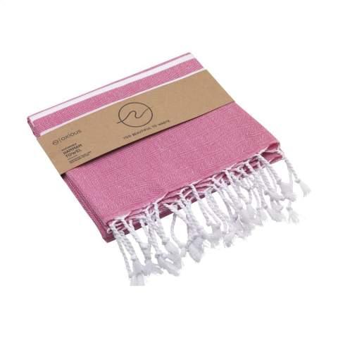 A multifunctional hammam towel from Oxious. Made from 50% OEKO-TEX® certified cotton and 50% recycled industrial textile waste (140 g/m²). Vibe is a wonderfully soft and stylish cloth with a cool stripe pattern. Beautiful as a shawl, dress on the couch, luxurious (hammam) cloth or towel. The cloth is handmade. Vibe symbolizes relaxation in a cozy atmosphere and environment.      These beautiful, soft cloths are made by local women in a small village in Turkey. They work there in a social context, with room for growth and development. The cloths are handmade with love and care for the environment. Pure enjoyment can begin with a product from the Oxious collection. Optional: Each item supplied in a kraft cardboard envelope and/or with a kraft sleeve.