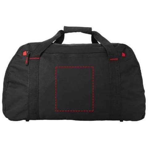 Große Reisetasche mit farbig abgesetzten Ziernähten und Reißverschlusstasche vorne und verstellbarem Schulterriemen.