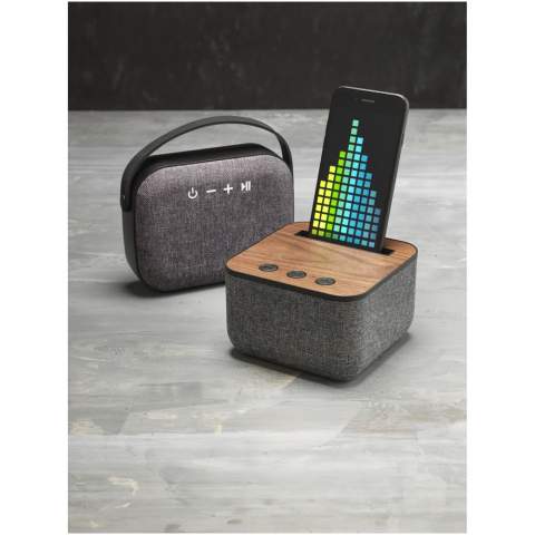 Enjoy exceptional sound of the Shae Fabric and Wood Bluetooth® Speaker. Be on trend with the knitted fabric cloth and real wood base. The speaker has a soft touch but packs a punch with a 5 watt speaker driver. The built-in music control and microphone allows you to control your music and to conference call from any location. The top slot can fit all major smart phones securely. Bluetooth® working range is 10 metres. Includes Micro USB to USB charging cable and 3.5mm audio cable. Playback time at max volume is up to 3 hours and it takes 3 hours to charge the speaker fully. Supplied in a white Avenue gift box. .