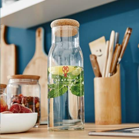 Elegant, glass carafe with a cork cap. For serving water, juice or alcoholic drinks. With a large opening for adding ice cubes and easy to clean. Capacity 1,000 ml.