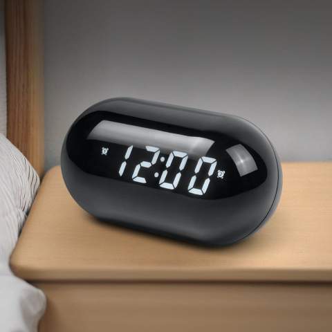 "Radio-réveil rond et compact, parfait pour toute chambre à coucher. D'une taille de 8 cm x 14,6 cm, cet élégant radio-réveil s'installe sans effort sur une table de chevet ou un bureau. Profitez d'un son clair et d'une interface conviviale, qui vous permet de syntoniser facilement votre station préférée ou de régler une alarme. L'affichage clair vous permet de toujours lire l'heure, même dans l'obscurité. Commencez la journée du bon pied grâce à la combinaison parfaite de fonctionnalité et de design de ce radio-réveil moderne !