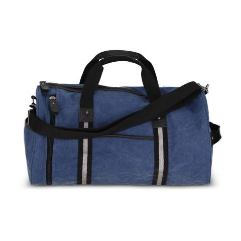 Stylish duffle bag made from recycled cotton canvas. Features 100% recycled reflective webbing, luxurious zips and pulls, and 100% recycled polyester lining. Includes a side grab handle, adjustable removable shoulder strap, 1 side pocket, 2 front pockets, and 3 interior pockets, one with a zip.