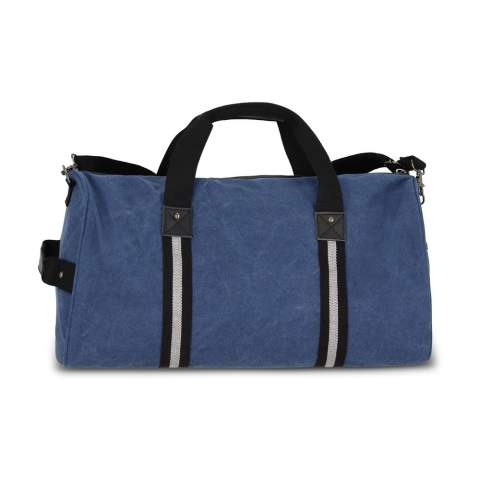 Stylish duffle bag made from recycled cotton canvas. Features 100% recycled reflective webbing, luxurious zips and pulls, and 100% recycled polyester lining. Includes a side grab handle, adjustable removable shoulder strap, 1 side pocket, 2 front pockets, and 3 interior pockets, one with a zip.