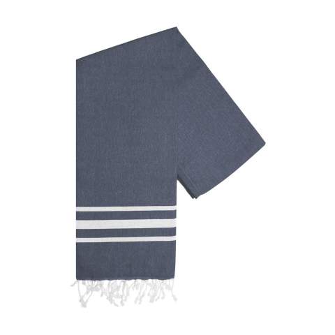 A multifunctional hammam towel from Oxious. Made from 50% OEKO-TEX® certified cotton and 50% recycled industrial textile waste (140 g/m²). Vibe is a wonderfully soft and stylish cloth with a cool stripe pattern. Beautiful as a shawl, dress on the couch, luxurious (hammam) cloth or towel. The cloth is handmade. Vibe symbolizes relaxation in a cozy atmosphere and environment.      These beautiful, soft cloths are made by local women in a small village in Turkey. They work there in a social context, with room for growth and development. The cloths are handmade with love and care for the environment. Pure enjoyment can begin with a product from the Oxious collection. Optional: Each item supplied in a kraft cardboard envelope and/or with a kraft sleeve.