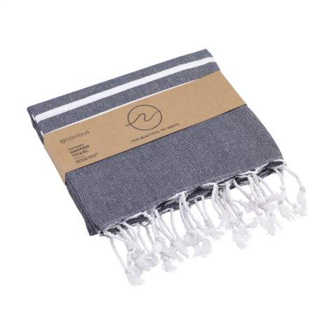 A multifunctional hammam towel from Oxious. Made from 50% OEKO-TEX® certified cotton and 50% recycled industrial textile waste (140 g/m²). Vibe is a wonderfully soft and stylish cloth with a cool stripe pattern. Beautiful as a shawl, dress on the couch, luxurious (hammam) cloth or towel. The cloth is handmade. Vibe symbolizes relaxation in a cozy atmosphere and environment.      These beautiful, soft cloths are made by local women in a small village in Turkey. They work there in a social context, with room for growth and development. The cloths are handmade with love and care for the environment. Pure enjoyment can begin with a product from the Oxious collection. Optional: Each item supplied in a kraft cardboard envelope and/or with a kraft sleeve.