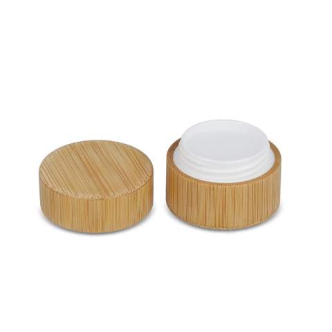 Lipbalm in a round cylindrical container made from bamboo. Offers moisturizing care in an eco-friendly design.