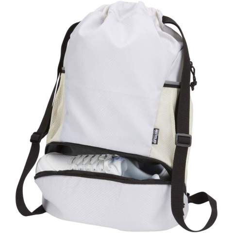 The Nomad sports drawstring bag is made from GRS certified recycled ripstop fabric with a water-repellent finish, GRS certified RPET lining, and reflective elements. It is designed for people with an active lifestyle and is suitable for daily exercise and sports activities. The bag has a spacious main compartment that can hold clothing, a towel, or even a basketball. A separate bottom compartment keeps shoes or used clothes apart from other items. It also includes two side mesh pockets with reflective details, one hidden zipped pocket for valuables, and adjustable webbing shoulder straps for comfortable carrying.