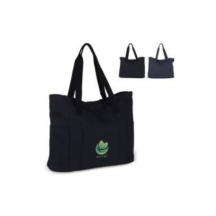 Spacious shopping bag made of recycled canvas. The structure and washed effect of the material gives the bag a sturdy look. The bag is completely lined, comes with cotton handles and a reinforced base. Thanks to the size and large opening, this bag is also suitable for a day on the beach.