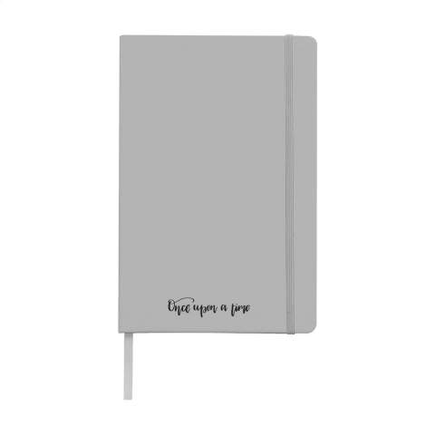 Notebook in A5 format with 96 pages cream coloured, lined paper (80 g/m²). With a perfect binding, hard cover, pocket, elastic fastener and silk ribbon.