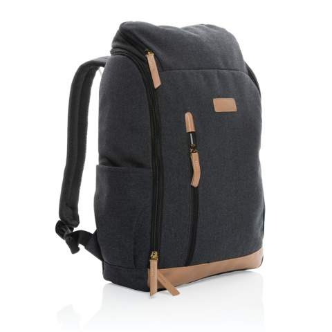 This clean 16oz. recycled canvas laptop backpack accompanies you on every commute through the professional landscape. With deep vertical front pocket and a neat easy wide open zipper that reveals a roomy interior complete with a 15 inch laptop compartment. Each laptop backpack saves 1257.2 litres of water. 2% of proceeds of each Impact product sold will be donated to Water.org. Composition 60% recycled cotton and 40% recycled polyester. Lining in 150D recycled polyester.