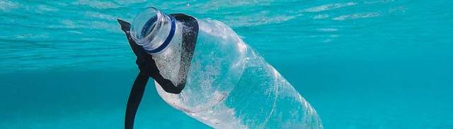 Dopper fights against the plastic soup in our oceans. Plastic water bottle floating in the ocean